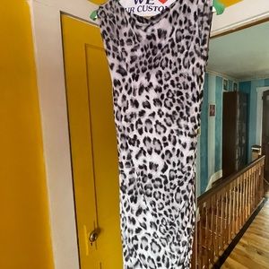 Animal print long sleeveless designer dress size M. Like new. Stretchable.